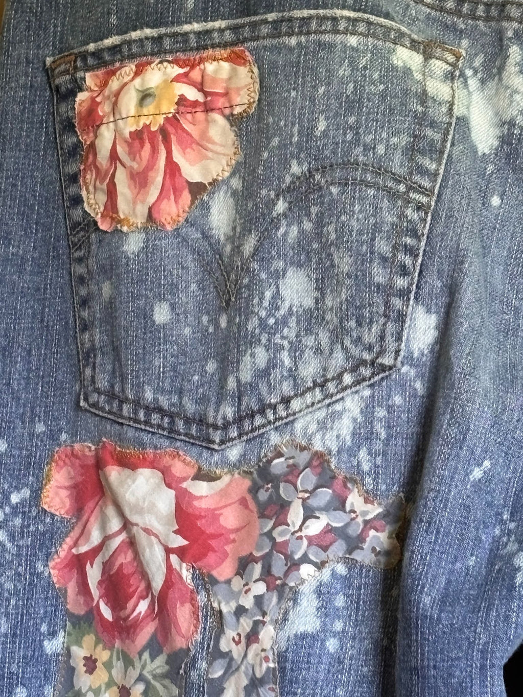 sewn patchwork on denim jeans