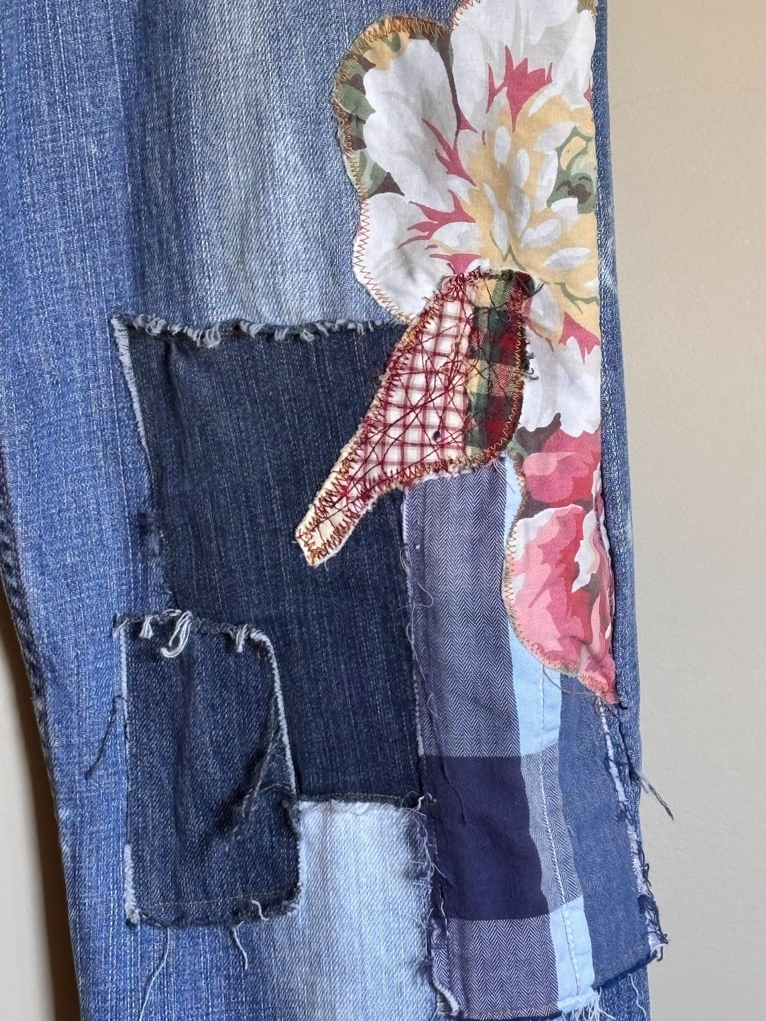 sewn patchwork on denim jeans