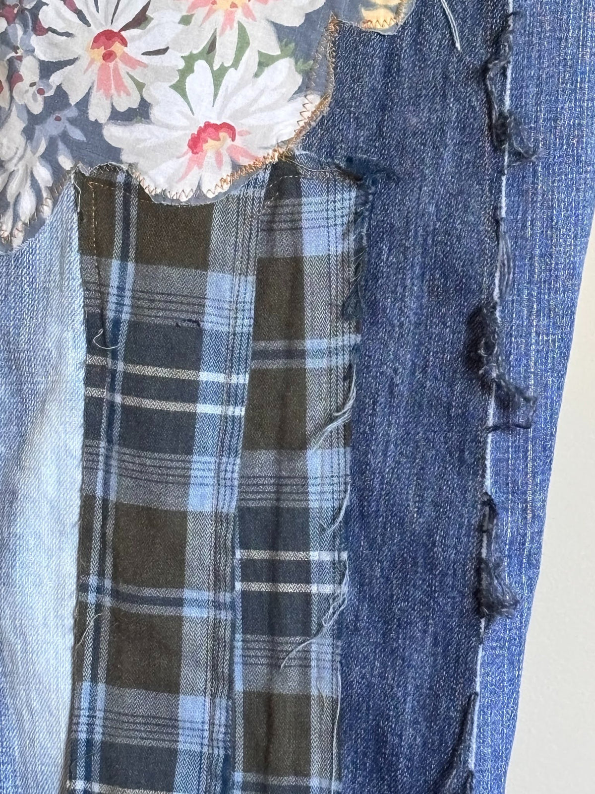 sewn patchwork on denim jeans