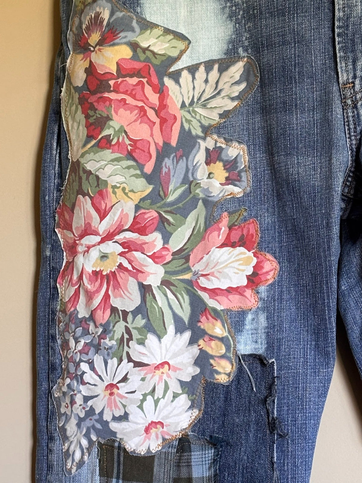 sewn patchwork on denim jeans